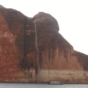 Waterfall at Powell with houseboat